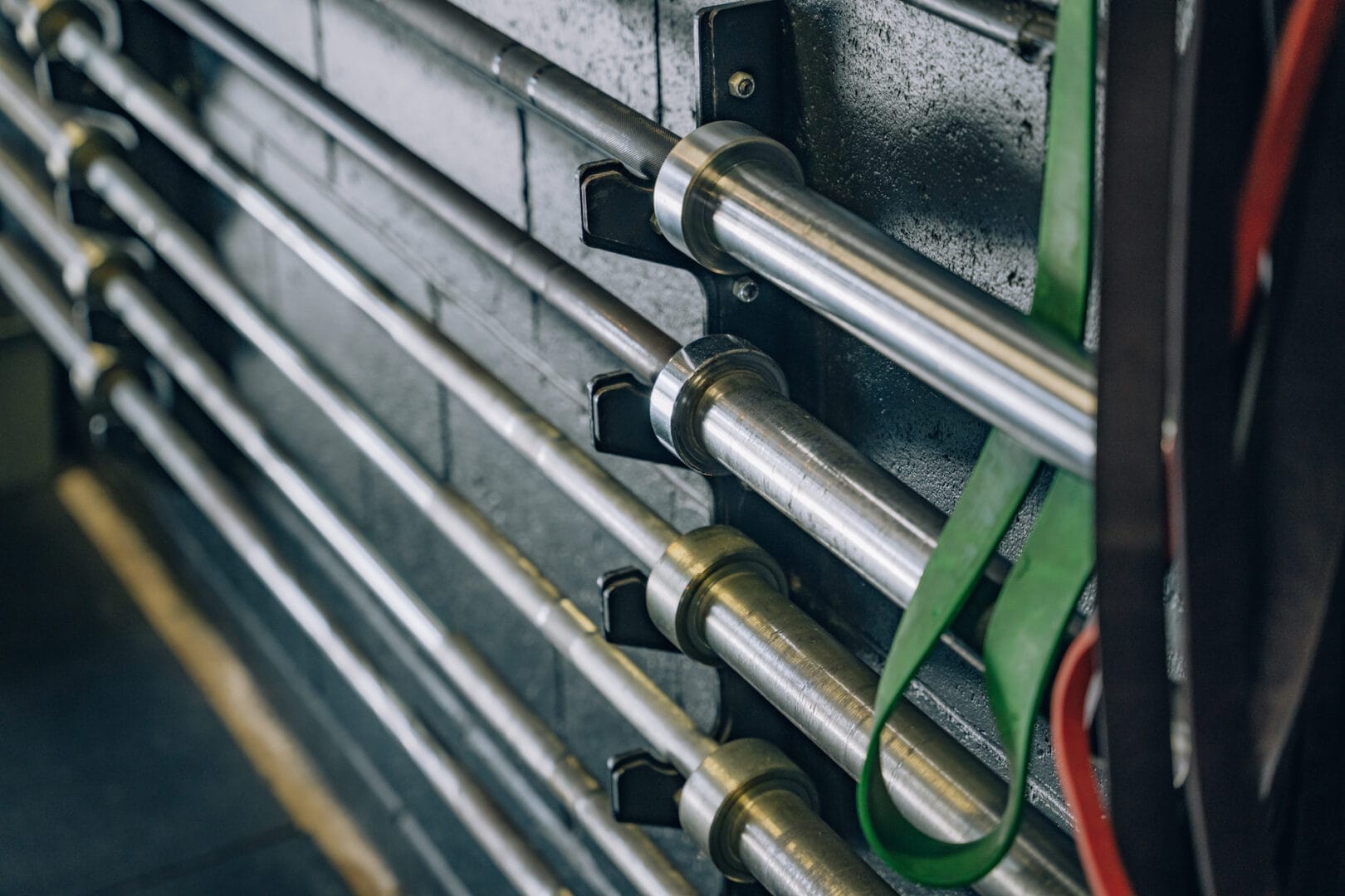 Organized Weight Bars Mounted on Wall