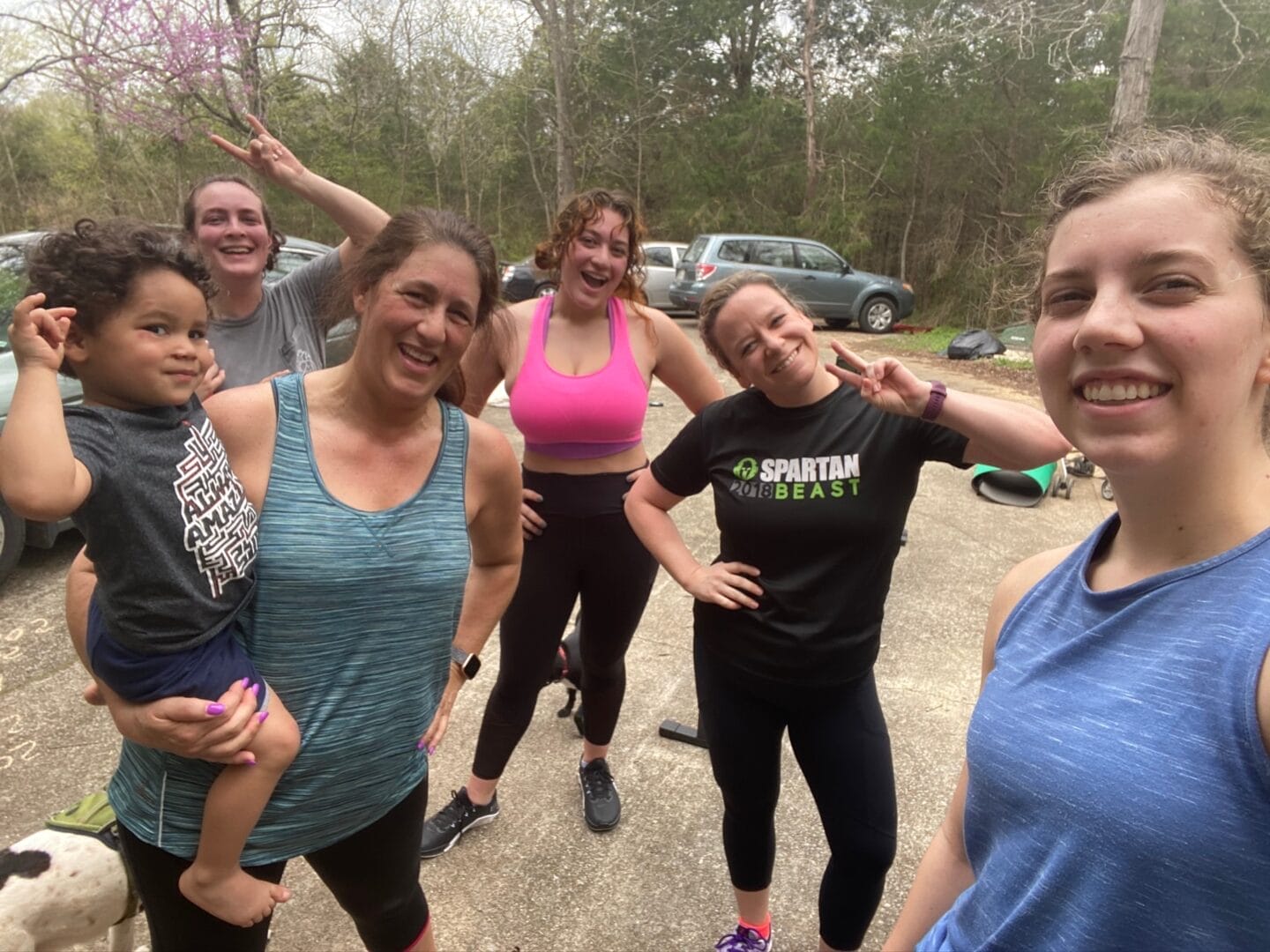 Elizabeth smiling with practicers at Smyrna Strength and Fitness